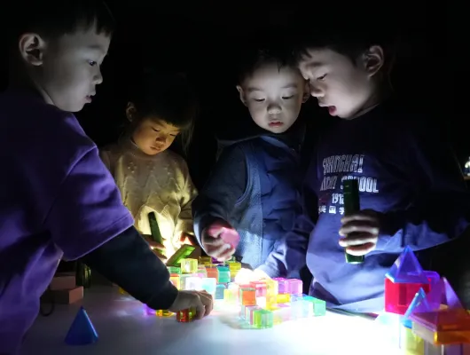 boys and girls playing at night